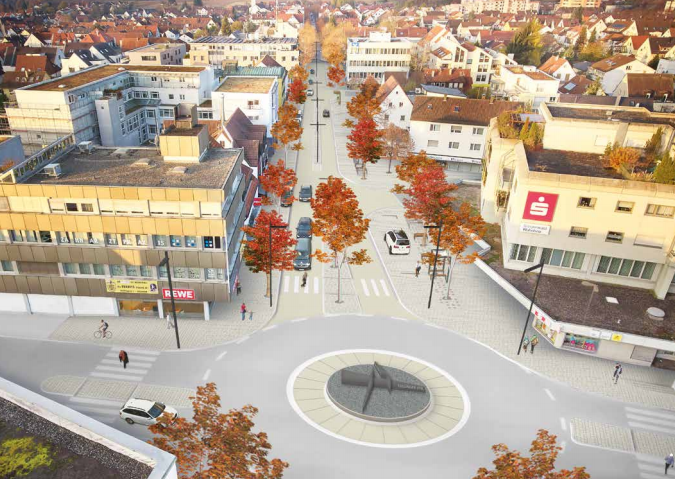 Es ist die Hindenburgstraße in Nellingen aus der Vogelperspektive zu sehen. Unten mittig befindet sich der Kreisverkehr. Davon gehen frei Abzweigungen weg. Entlang der Straßen sind Häuser zu sehen.