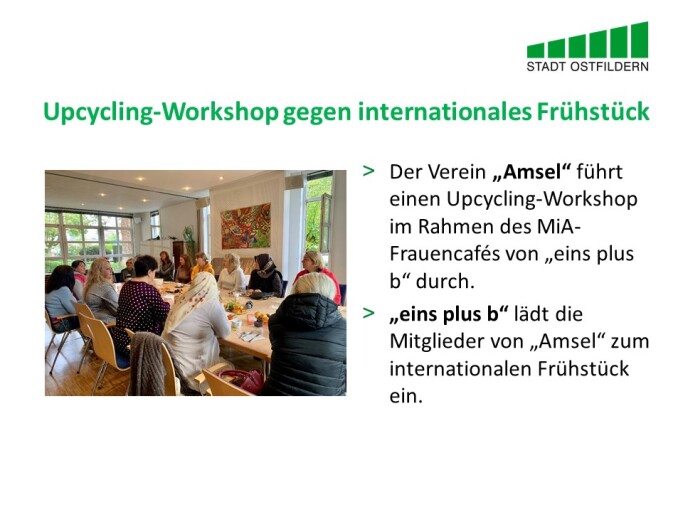 m oberen Bereich steht der Titel der Vereinbarung beim Digitalen Marktplatz der Guten Geschäfte: Upcycling-Workshop gegen internationales Frühstück.
Rechts wird die Vereinbarung erklärt. Der Verein „Amsel“ führt einen Upcycling-Workshop im Rahmen des MiA-Frauencafés von eins plus b durch. eins plus b lädt die Mitglieder von Amsel zum internationalen Frühstück ein.
Auf der linken Seite ist ein Bild des Frühstücks zu sehen.